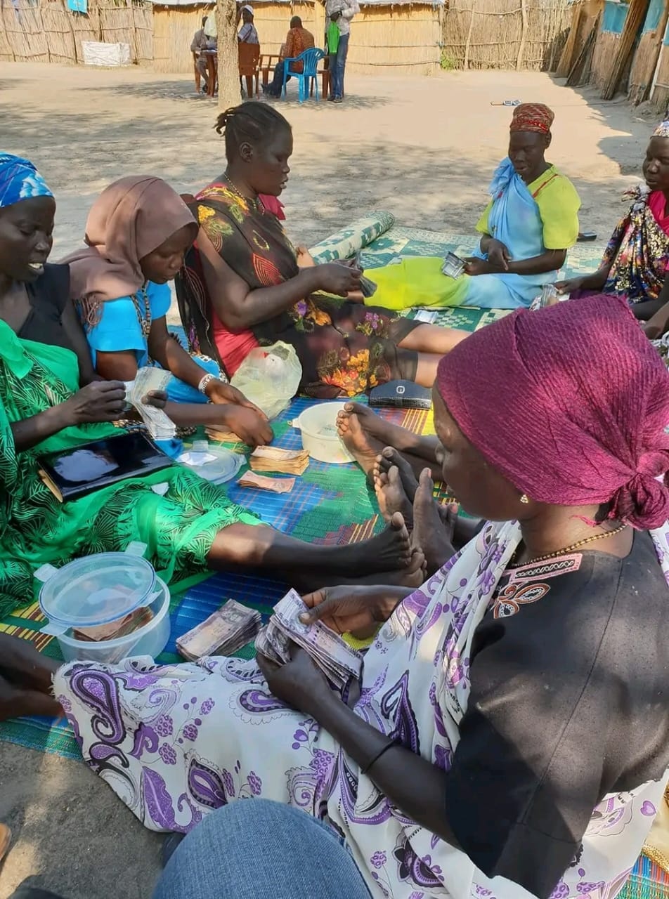 Women participating in a savings group activity